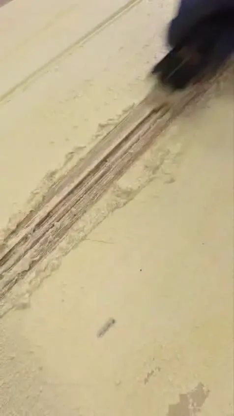 Hand stripping a beaded plank door in the workshop